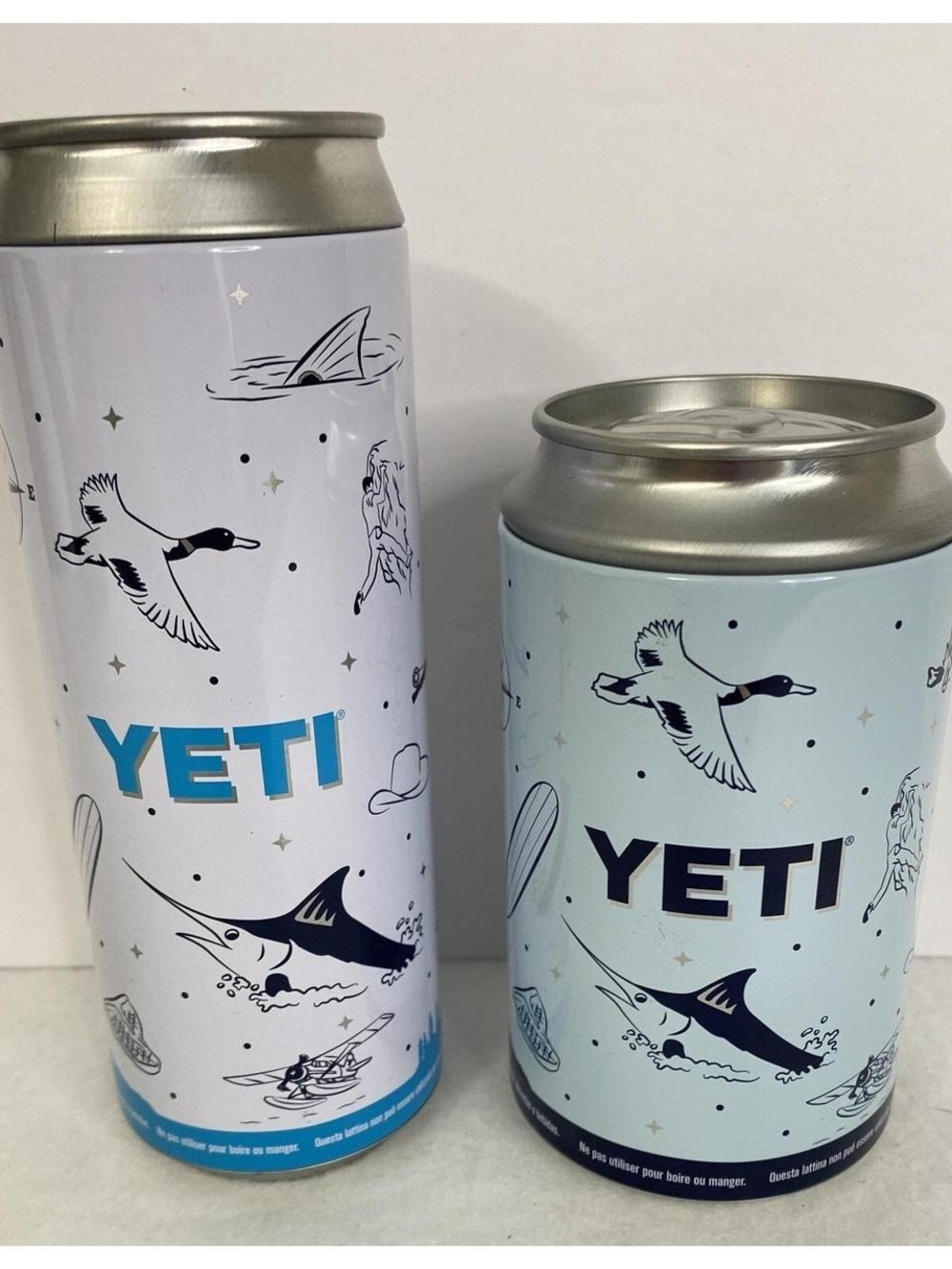 Yeti Light Blue and Silver Ocean Graphic stash cans.